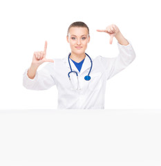 A professional and cheerful female doctor showing something