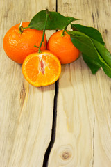 Tangerines on wooden background.