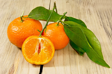 Tangerines on wooden background.