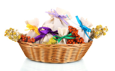 Textile sachet pouches with dried flowers, herbs  and berries