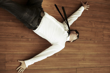 Yuong man in despair lying on the floor