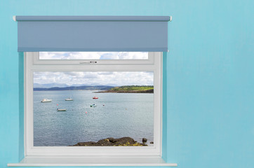 View of sea harbour with boats from a window