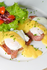 Eggs Benedict- toasted English muffins, ham, poached eggs