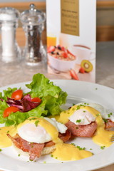 Eggs Benedict- toasted English muffins, ham, poached eggs