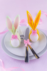 Easter table set with eggs in bunny napkins