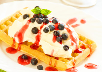 Waffles with fruits and whipped cream
