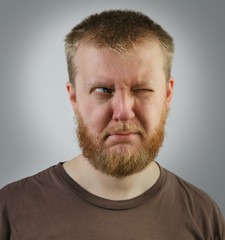 Fototapeta premium Man looking off to the side with one eye