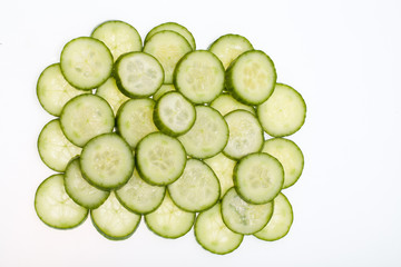 Freshly sliced cucumber  isolated on white background