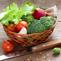 vegetables in the basket on a wood table