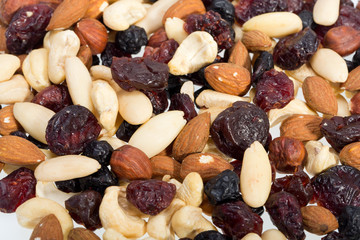 mixed nuts and dried fruits isolated on white background