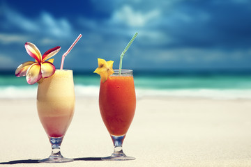 fresh fruit juices on a tropical beach