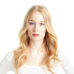 Close-up of a beautiful young woman smiling on white background