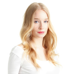 Naklejka premium Close-up of a beautiful young woman smiling on white background
