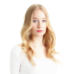 Naklejka premium Close-up of a beautiful young woman smiling on white background