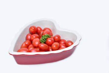 Cherry tomatoes in heart-shaped bowl