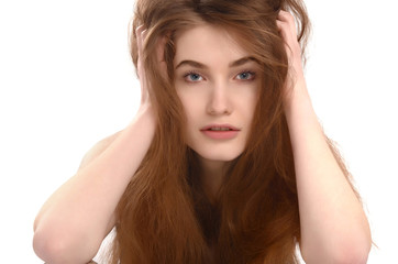 Young girl with messy long brown hair. Bad hair day. 