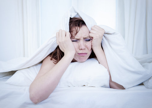 woman in bed with insomnia that can't sleep white background