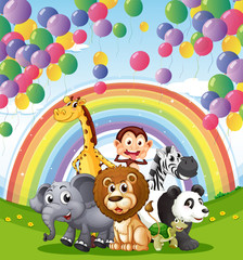 Naklejka premium Animals below the floating balloons and rainbow