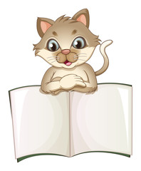 A brown cat opening an empty notebook