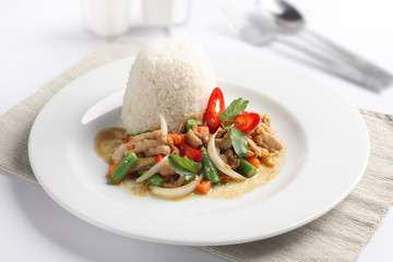 Thai spicy food, stir fried chicken  on rice.
