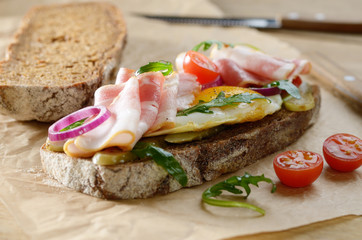 Bacon and fried egg open sandwich