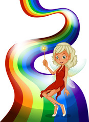 A smiling fairy above the rainbow