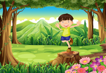 Obraz na płótnie Canvas A playful kid above the stump at the forest