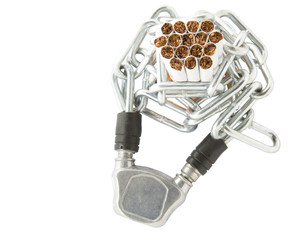 Concept image of cigarette addiction locked away