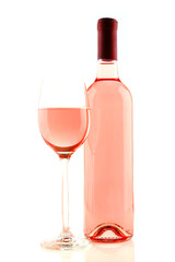 Bottle and glass of rose wine isolated