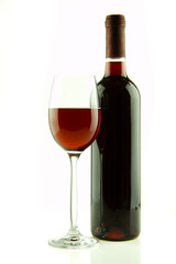 Bottle and glass of red wine isolated