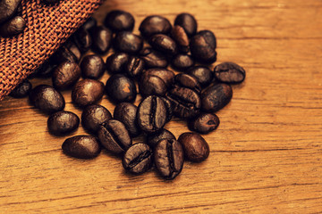 Vintage roasted coffee beans On the old background