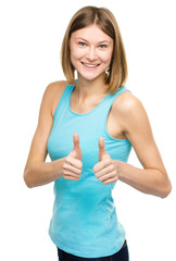 Woman is showing thumb up gesture