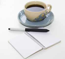 cup of coffee with notebook
