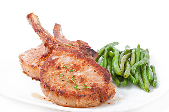 Juicy grilled pork fillet steak with with green beans