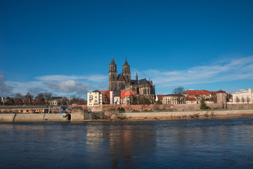 Magnificent Cathedral of Magdeburg at river Elbe with blue sky,