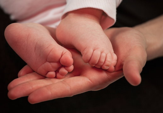 Tiny Newborn Baby`s feet