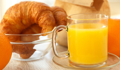 Healthy orange juice and croissants