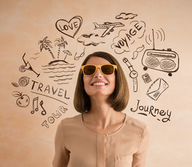Positive smiling woman wearing sunglasses planning her vacation