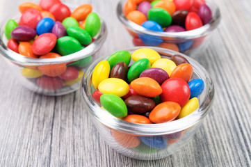 Colorful hard candies in glass bowls