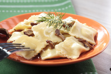 Portion of ravioli with mushrooms and sauerkraut