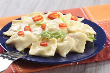 Portion of ravioli with red pepper