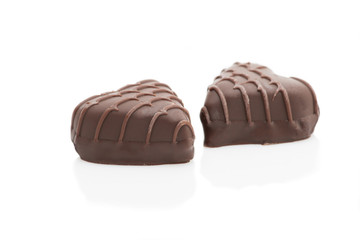 Chocolate hearts on white background