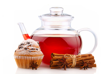 Teapot with hibiscus tea, spices and cake isolated