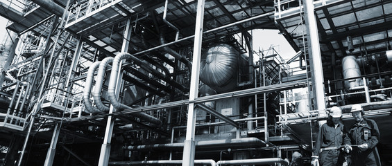 oil and gas workers inside petrochemical refinery