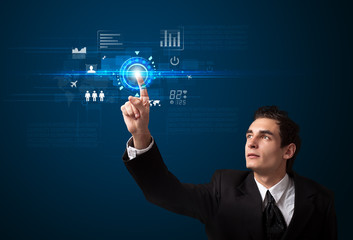 Handsome businessman touching future web technology buttons and