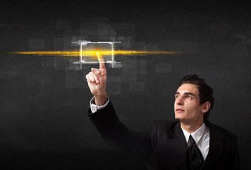 Tech business person touching button with orange light beams con