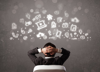 Business man looking at modern icons and symbols
