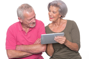 Senior couple with tablet