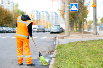 Road sweeper cleaning street with broom tool
