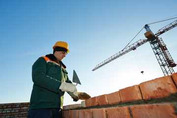 Naklejka na ściany i meble construction mason worker bricklayer
